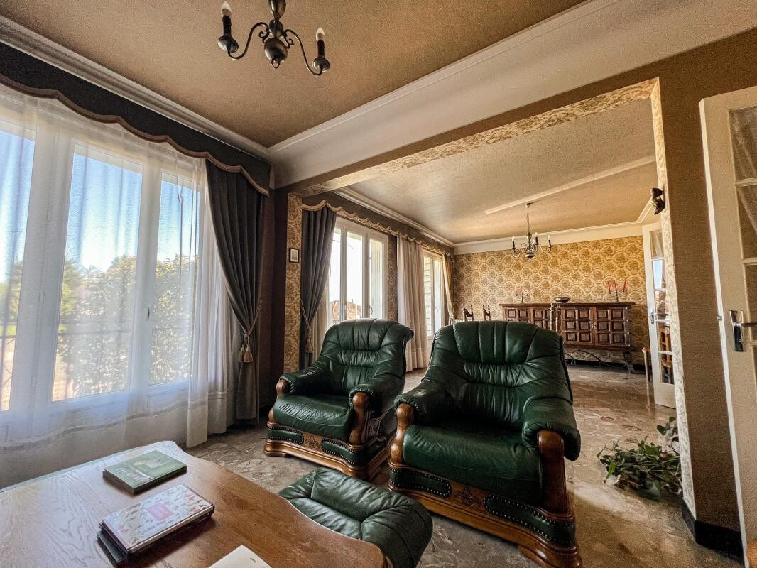 Photo 2 : Maison familiale des années 70 avec jardin arboré à 10 min d