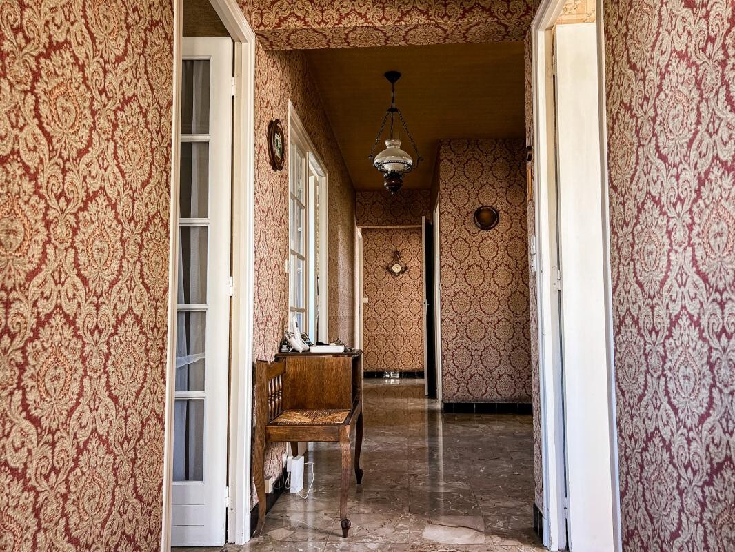 Photo 3 : Maison familiale des années 70 avec jardin arboré à 10 min d